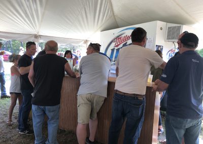 A crowd getting their cold beers